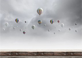 Obraz na szkle - Balony nad ceglaną ścianą (70x50 cm)