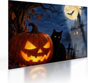 Obraz na szkle - Czarny kot przy świecącej dyni na Halloween (70x50 cm)