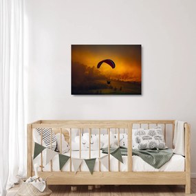 Obraz na szkle - spadochroniarz o zachodzie słońca (70x50 cm)