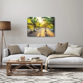 Obraz na szkle - Kobieta w palmach (70x50 cm)