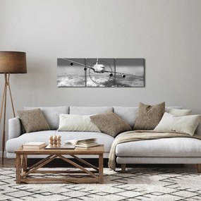 Obraz - Samolot w chmurach, czarno-biały (z zegarem) (90x30 cm)