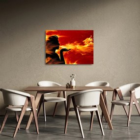 Obraz na szkle kobiety z płomieniami (70x50 cm)