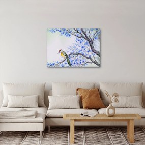 Obraz - ptak na drzewie z niebieskimi kwiatami (70x50 cm)