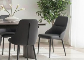 Eleganckie czarne krzesło Monolit tapicerowane ekoskórą PU, wygodne, nowoczesne i idealne do jadalni lub biura. Smukłe metalowe nogi dodają mu lekkości i stylu.