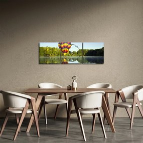 Obraz balonu na ogrzane powietrze nad jeziorem (z zegarem) (90x30 cm)