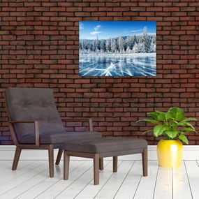 Obraz na szkle zamarzniętego jeziora i pokrytych śniegiem drzew (70x50 cm)