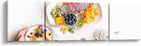 Obraz talerzy z owocami na stole (170x50 cm)