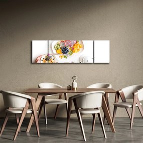 Obraz talerzy z owocami na stole (170x50 cm)