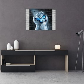 Obraz na szkle niebieskiego motyla na ścianie (70x50 cm)