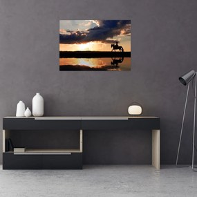 Obraz na szkle - Jeździec na koniu o zachodzie słońca (70x50 cm)