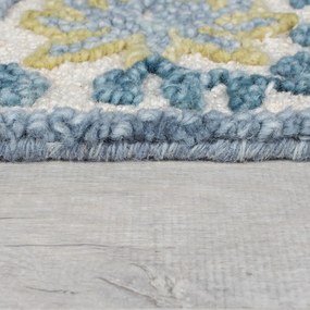 Niebiesko-kremowy dywan z mieszanki wełny tkany ręcznie 120x170 cm Myla Floral Frame – Flair Rugs