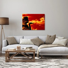 Obraz na szkle kobiety z płomieniami (70x50 cm)