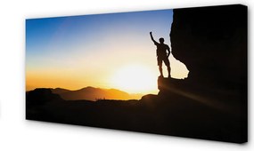 Obraz drukowany na płótnie Człowiek w Górach o Zachodzie