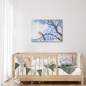 Obraz na szkle - ptak na drzewie z niebieskimi kwiatami (70x50 cm)