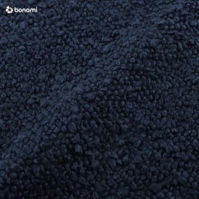 Ciemnoniebieska rozkładana sofa ze schowkiem z materiału bouclé 222 cm Bali – Cosmopolitan Design