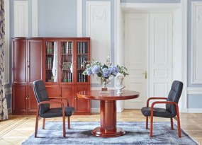 Elegancki stół biurowy o okrągłym blacie Conference. Dwa rozmiary średnicy do wyboru: 90 cm i 120 cm. Stół fornirowany drewnem w odcieniu koniaku, okrągła podstawa, stylowe wykończenie.