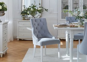 Eleganckie krzesło do jadalni lub salonu Opera niebieskie. Krzesło z pikowanym oparciem chesterfield, drewniane białe nogi. Tkanina welwetowa odporna na wsiąkanie płynów.