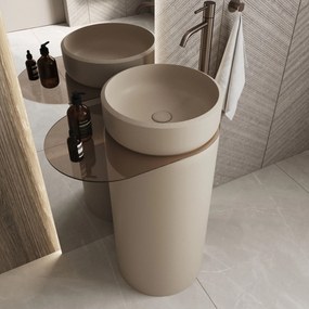 Umywalka z konglomeratu wolnostojąca okrągła z półką szklaną 85 x 40 cm RONA bez przelewu | Różne kolory półki : Kolor szkła - Grafitowy, Kolor umywalki RONA - Beż matowy, Podłączenie syfonu - Do ściany, Półka - Szklana