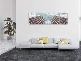 Obraz samolotu między budynkami (170x50 cm)
