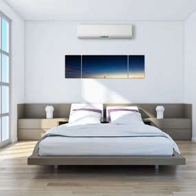 Obraz latarni morskiej w oddali (170x50 cm)