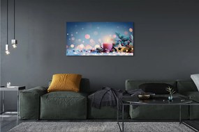 Obraz drukowany na płótnie Świeca i Śnieg w Świątecznej Scenerii