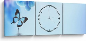 Obraz - Motyl na kwiatach orchidei, niebieski (z zegarem) (90x30 cm)