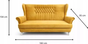 Tapicerowana sofa uszak z przeszyciami i pikowaniem na oparciu