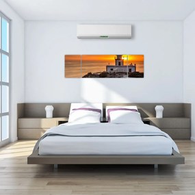 Obraz latarni morskiej o zachodzie słońca (170x50 cm)