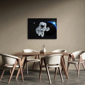 Obraz na szkle - Astronauta w kosmosie (70x50 cm)