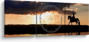 Obraz - Jeździec na koniu o zachodzie słońca (z zegarem) (90x30 cm)