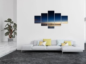 Obraz latarni morskiej w oddali (125x70 cm)