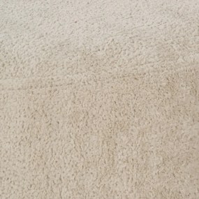 Beżowy puf z materiału bouclé – Ixia