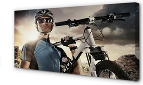 Obraz drukowany na płótnie Rowerzysta na Tle Chmur