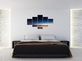 Obraz latarni morskiej w oddali (125x70 cm)