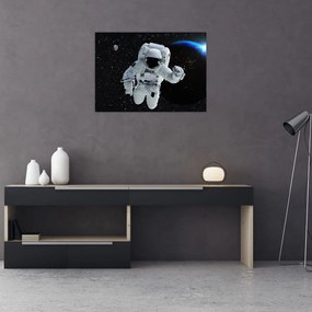 Obraz na szkle - Astronauta w kosmosie (70x50 cm)