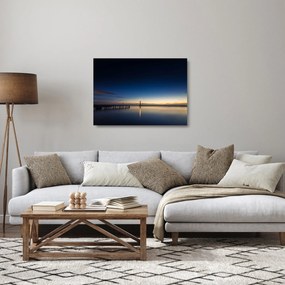 Obraz na szkle latarni morskiej w oddali (70x50 cm)