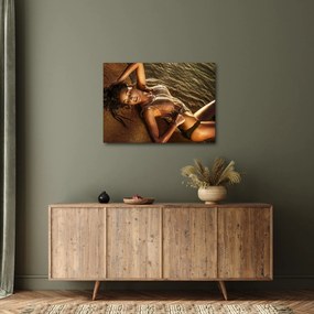 Obraz kobiety leżącej na plaży (70x50 cm)