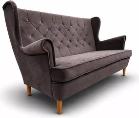 Nowoczesna sofa uszak z przeszyciami i pikowaniem po całości