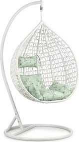 Białe wiszące krzesło KOKON ze stojakiem, jasnozielona poduszka ze wzorem