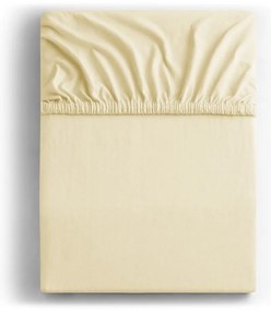 Kremowe dżersejowe prześcieradło z gumką 140x200 cm Amber – Restilo