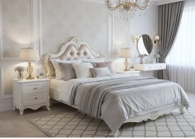 Stylowa szafka nocna Amenite, o wymiarach 60x55 cm, w kolorze ecru. 2 szufladki, ozdobne fronty, cokół, gałki. Styl francuski, kolekcja La Perle.