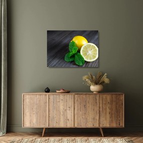 Obraz na szkle - cytryn i mięty na stole (70x50 cm)