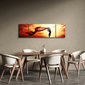 Obraz - Sylwetka kobiety o zachodzie słońca (170x50 cm)