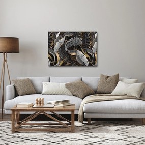 Obraz - Tropikalne liście w kolorze czarno - złotym (70x50 cm)