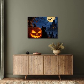 Obraz - Czarny kot przy świecącej dyni na Halloween (70x50 cm)