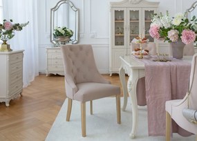 Eleganckie krzesło do jadalni lub salonu Opera beżowe, bukowe nogi. Krzesło z pikowanym oparciem chesterfield, drewniane białe nogi. Tkanina welwetowa, odporna na wsiąkanie płynów.