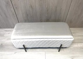 Elegancka tapicerowana pufa Tanis z pojemnikiem w stylu glamour na nogach