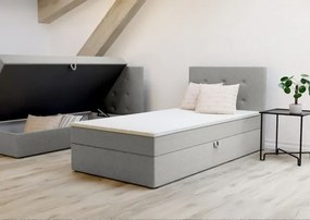 Jednoosobowe łóżko Bastian 90cm, posiada duży pojemnik, tapicerowane w kolorze szarym, prawe