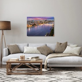Obraz na szkle - nocne miasto Bratysława z rzeką (70x50 cm)