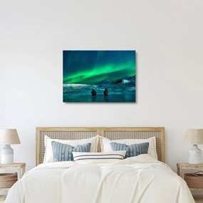 Obraz na szkle ludzi w pobliżu zorzy polarnej (70x50 cm)